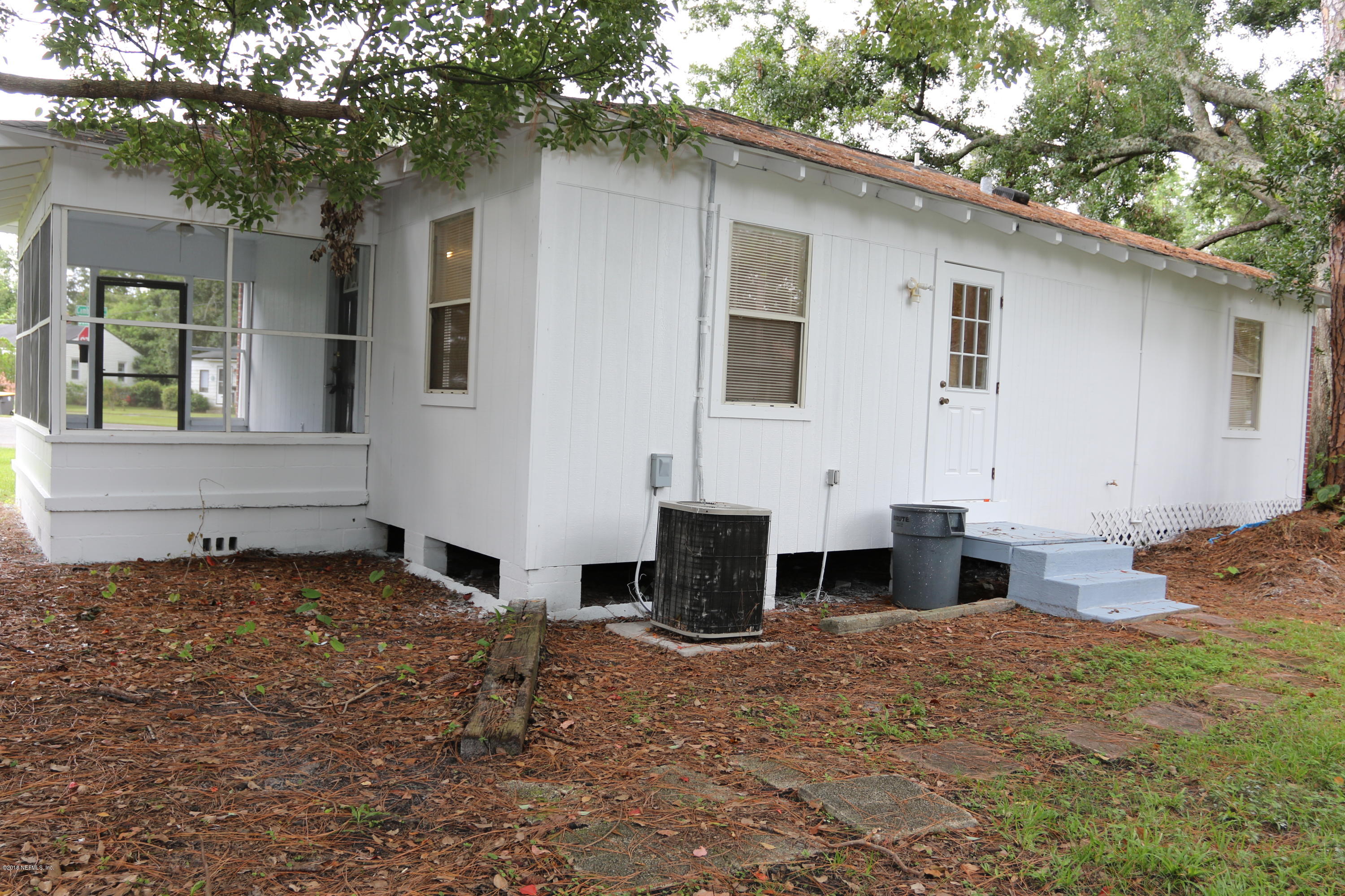 4909 Dundee Road Jacksonville, FL 32210 - Photo 3 of 18 a front view of house with yard