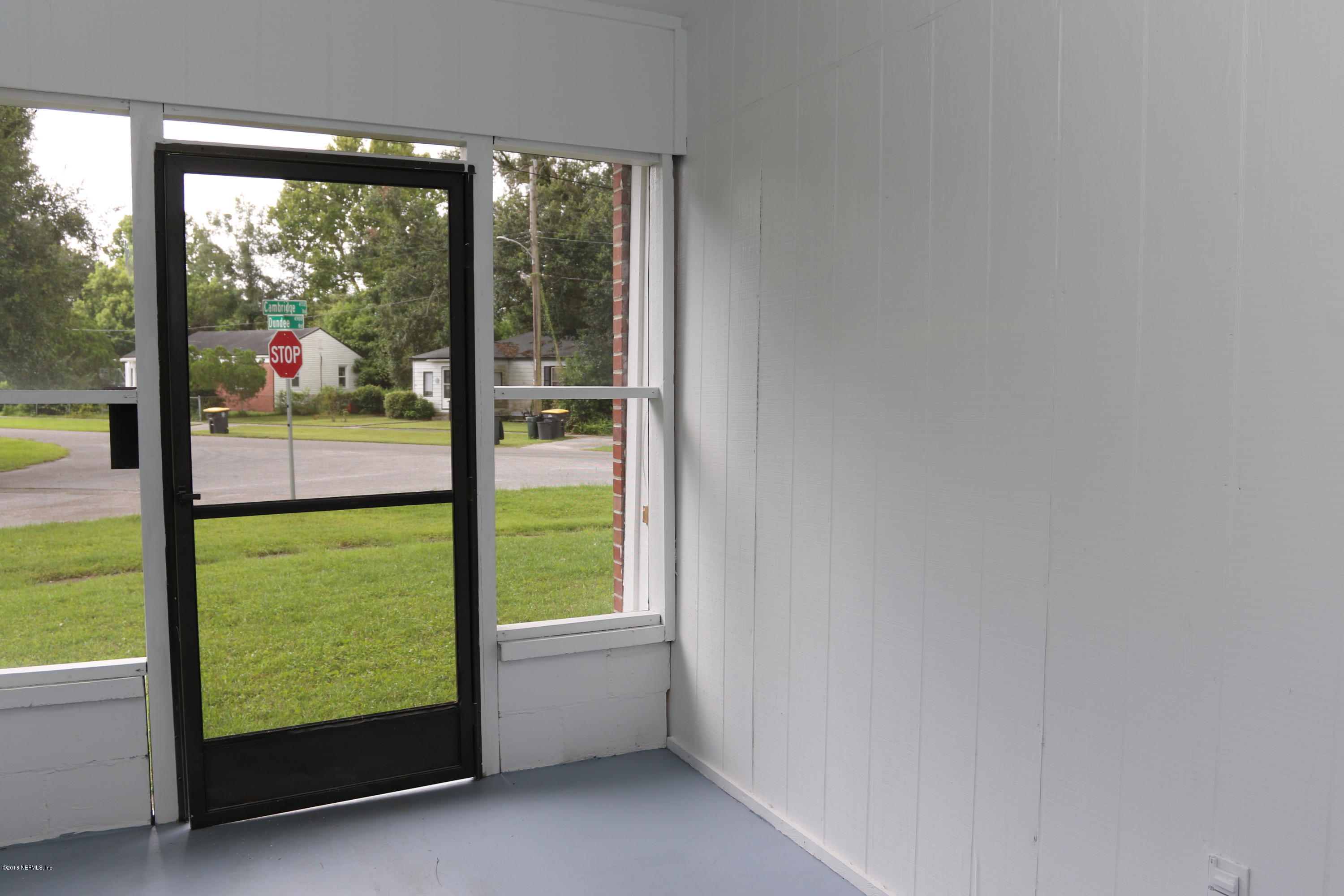 4909 Dundee Road Jacksonville, FL 32210 - Photo 7 of 18 a view of an empty room and window