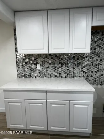 a living room with furniture fireplace and windows