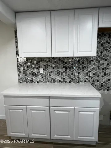 a living room with furniture fireplace and windows