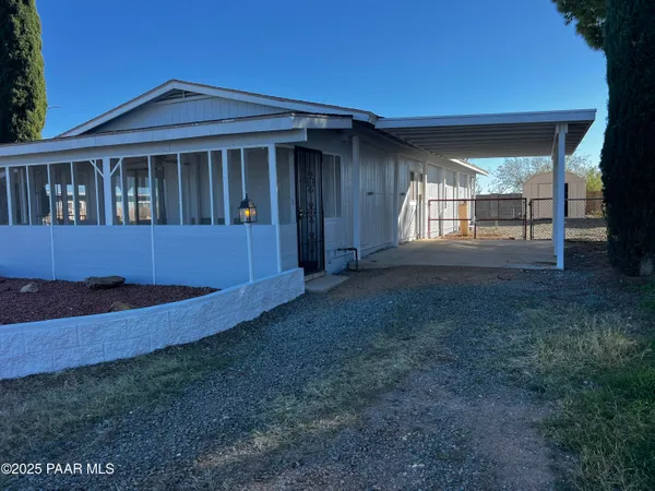 a house view with a garden space