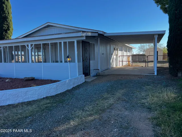 a house view with a garden space