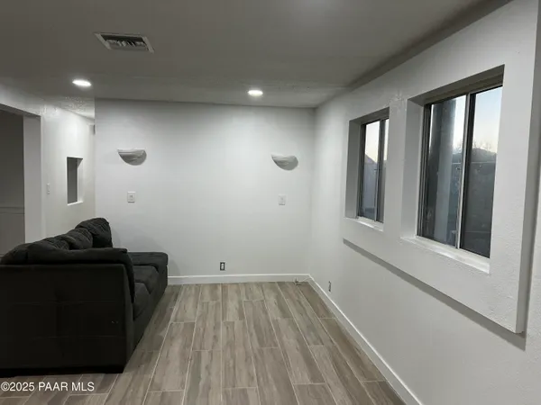 a kitchen with stainless steel appliances a refrigerator sink and cabinets