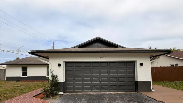 a front view of a house with a garage