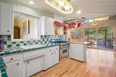 a kitchen with cabinets a sink and appliances