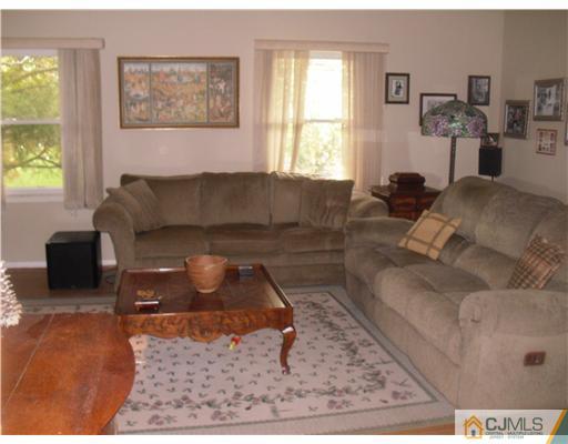 38 Wilk Road Edison, NJ 08837 - Photo 16 of 25 a living room with furniture and a window