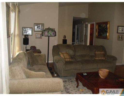 38 Wilk Road Edison, NJ 08837 - Photo 17 of 25 a living room with furniture and wooden floor