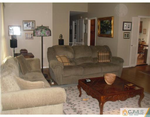 38 Wilk Road Edison, NJ 08837 - Photo 3 of 25 a living room with furniture and wooden floor