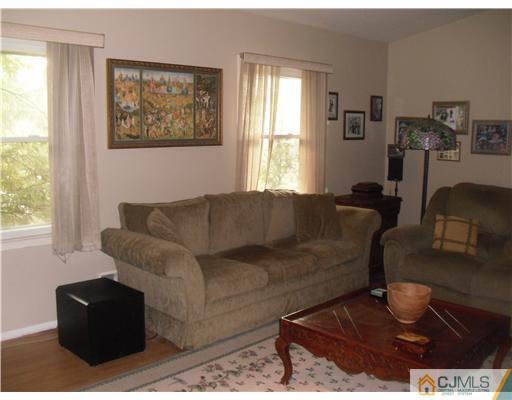 38 Wilk Road Edison, NJ 08837 - Photo 23 of 25 a living room with furniture and a window