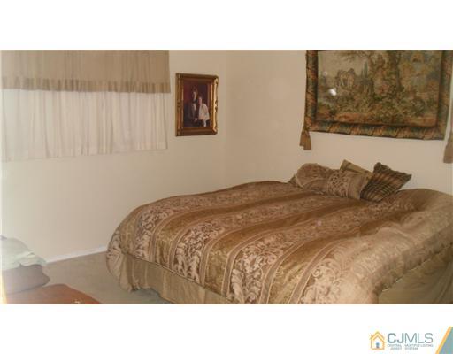 38 Wilk Road Edison, NJ 08837 - Photo 24 of 25 a black and white photo of a bedroom