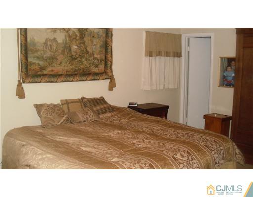 38 Wilk Road Edison, NJ 08837 - Photo 8 of 25 a black and white photo of a bedroom
