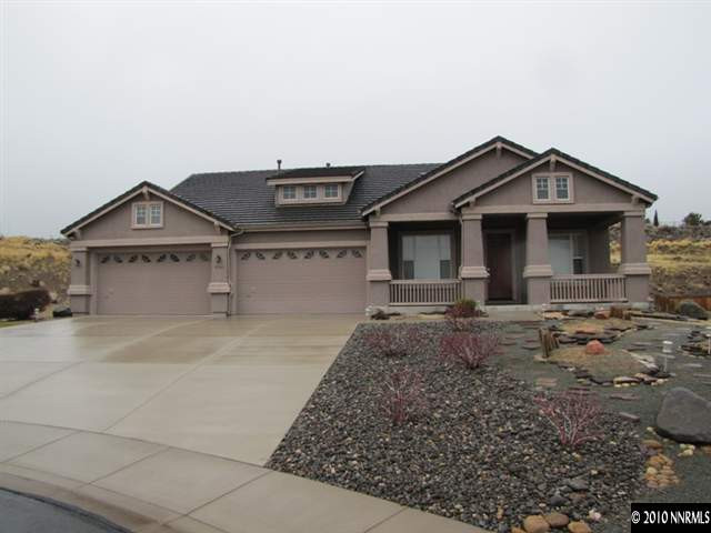 5547 New Mexico Court Reno, NV 89511 - Photo 1 of 12 a front view of a house with a yard