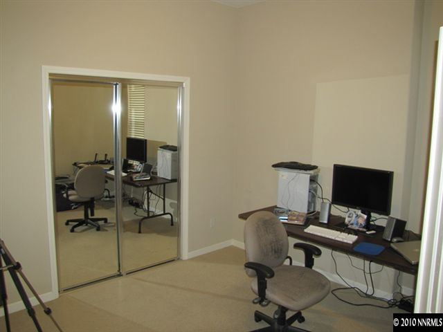 5547 New Mexico Court Reno, NV 89511 - Photo 5 of 12 a view of a workspace with furniture and a mirror