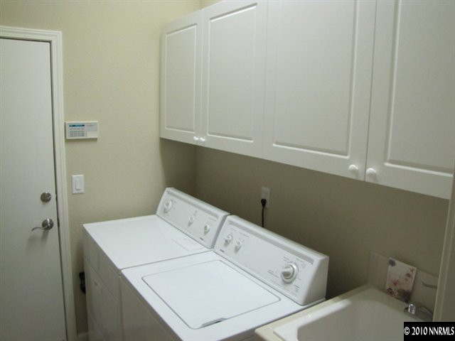 5547 New Mexico Court Reno, NV 89511 - Photo 9 of 12 a utility room with dryer and washer