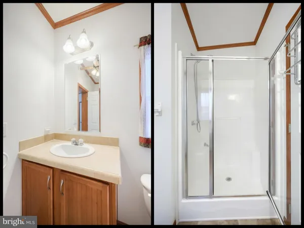 a bathroom with a toilet sink and shower