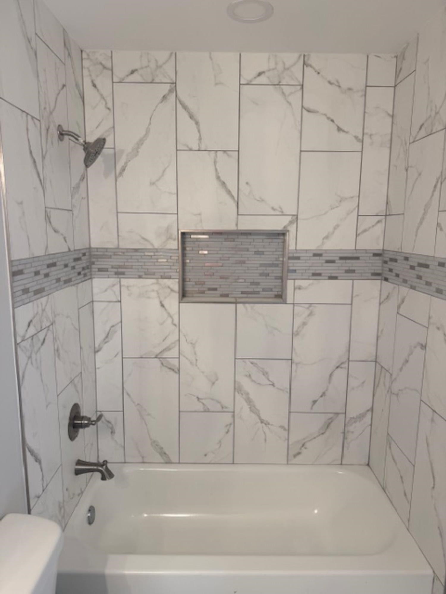 3245 Norton Road Memphis, TN 38109 - Photo 2 of 5 a bathroom with a bathtub and shower