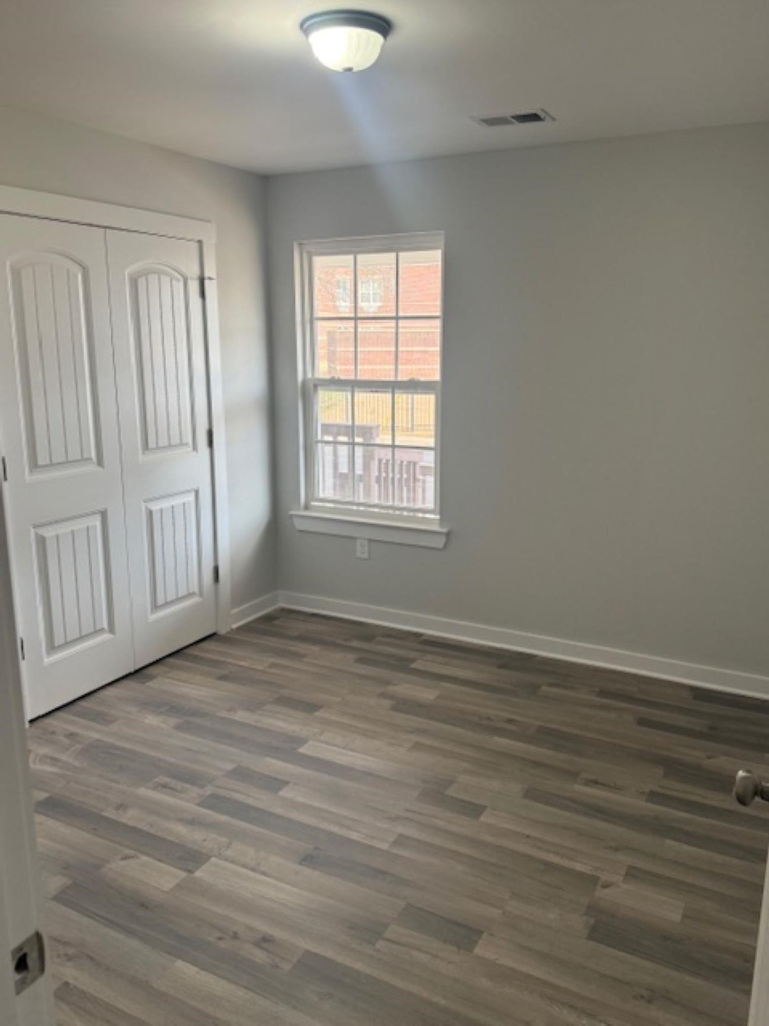 3245 Norton Road Memphis, TN 38109 - Photo 5 of 5 wooden floor in an empty room with a window
