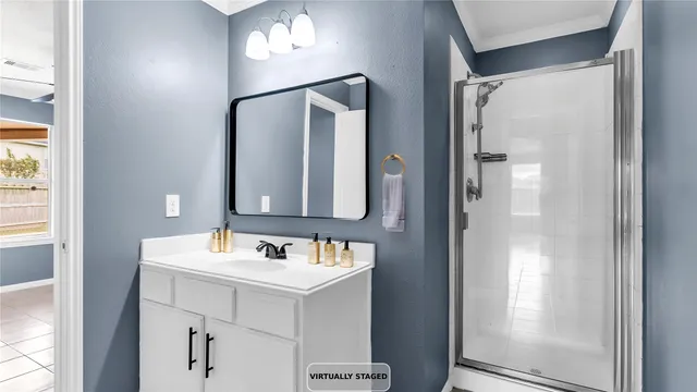 a bedroom with bed and window