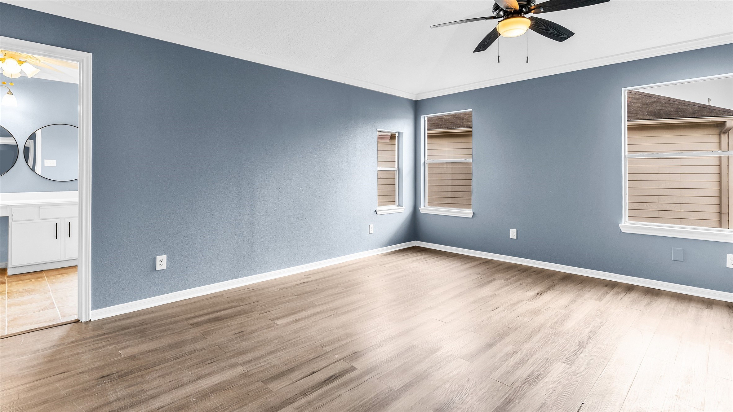 5534 Calm Court Houston, TX 77084 - Photo 21 of 44 wooden floor in an empty room with a window