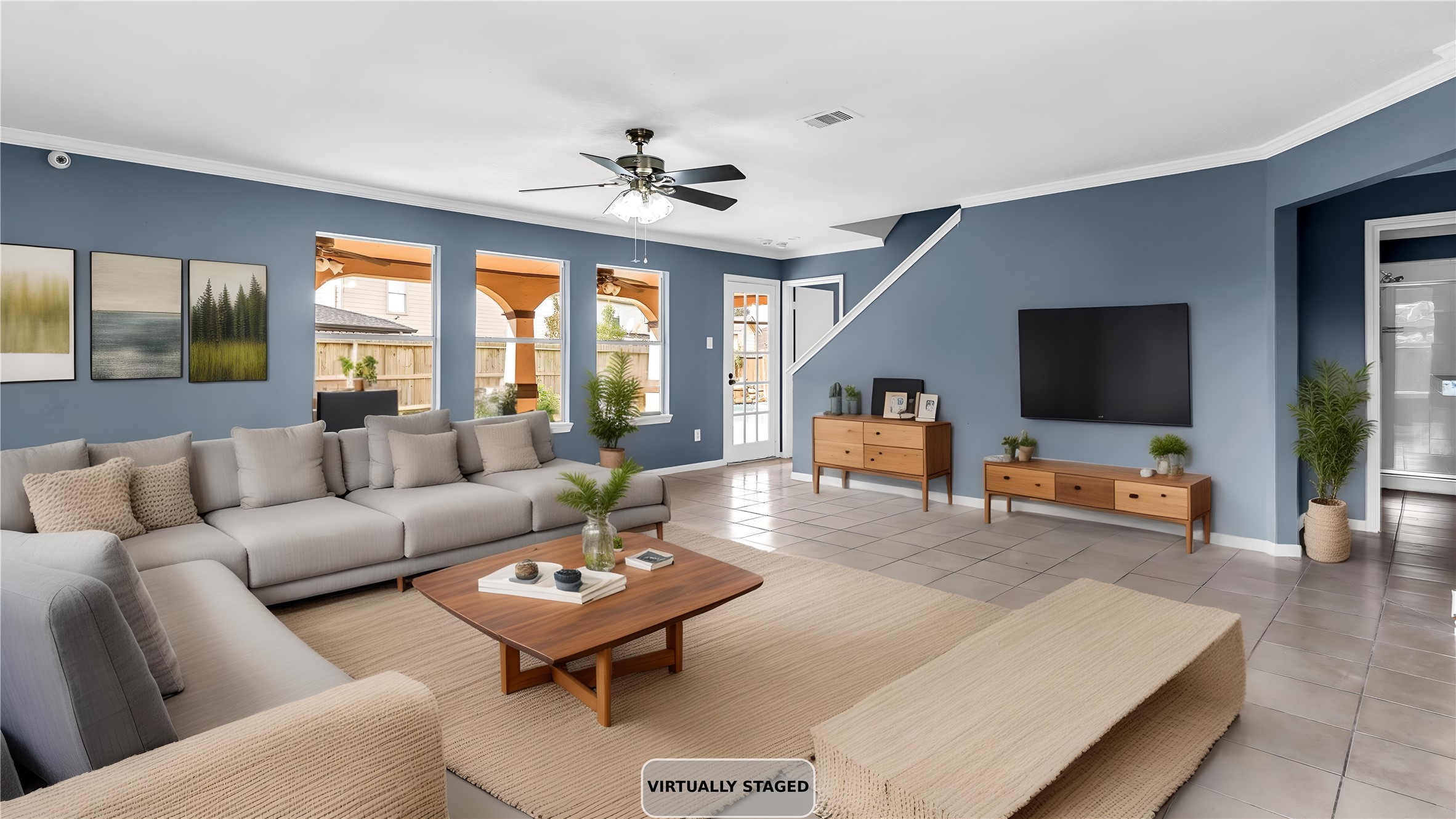 5534 Calm Court Houston, TX 77084 - Photo 3 of 44 a living room with furniture and a flat screen tv