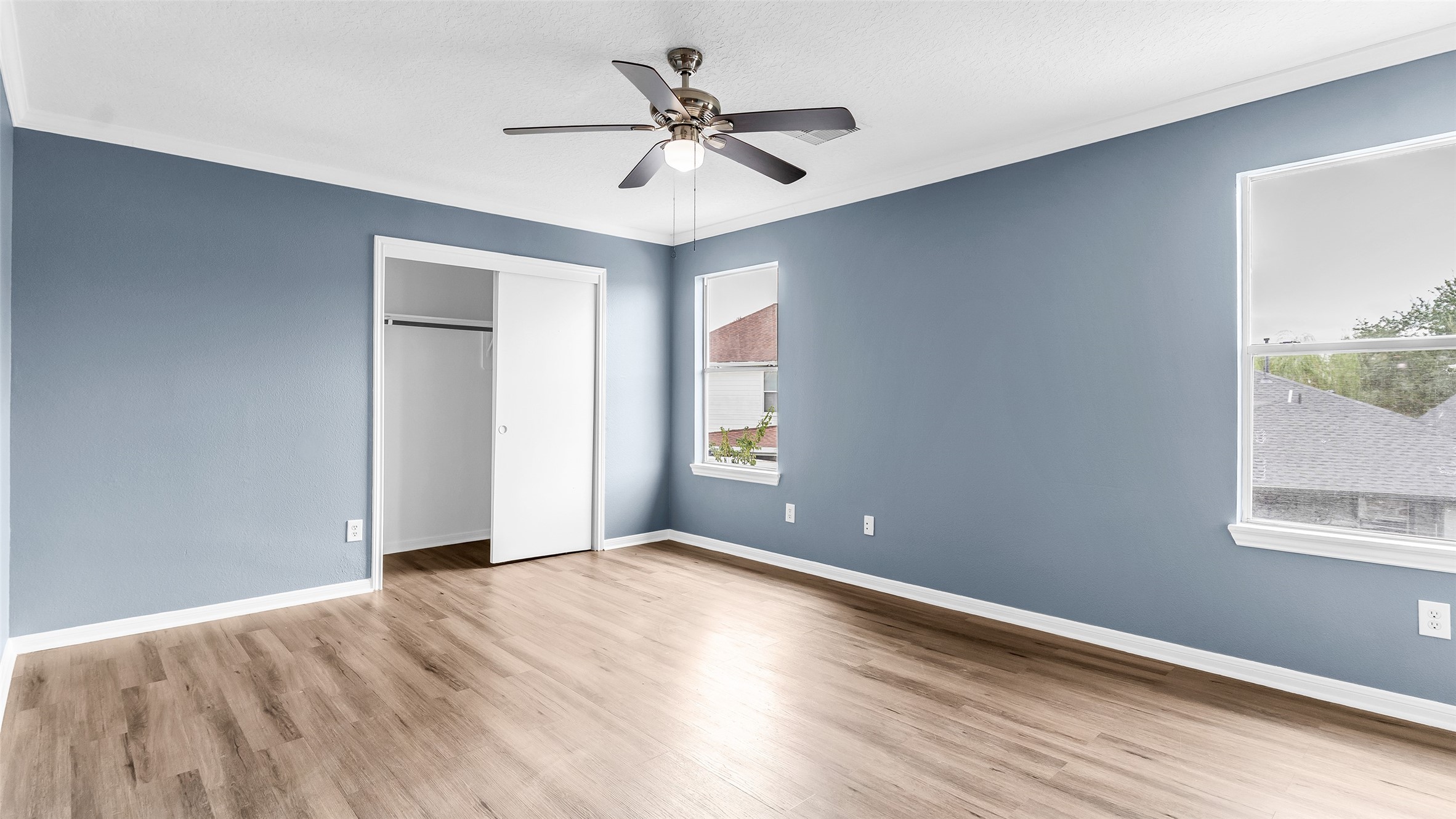 5534 Calm Court Houston, TX 77084 - Photo 32 of 44 wooden floor in an empty room with a window