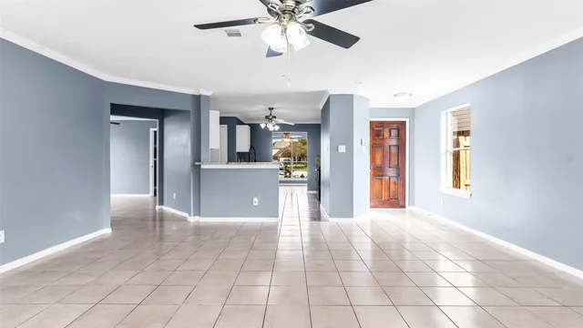 a kitchen with a stove top oven a sink a counter top space and cabinets