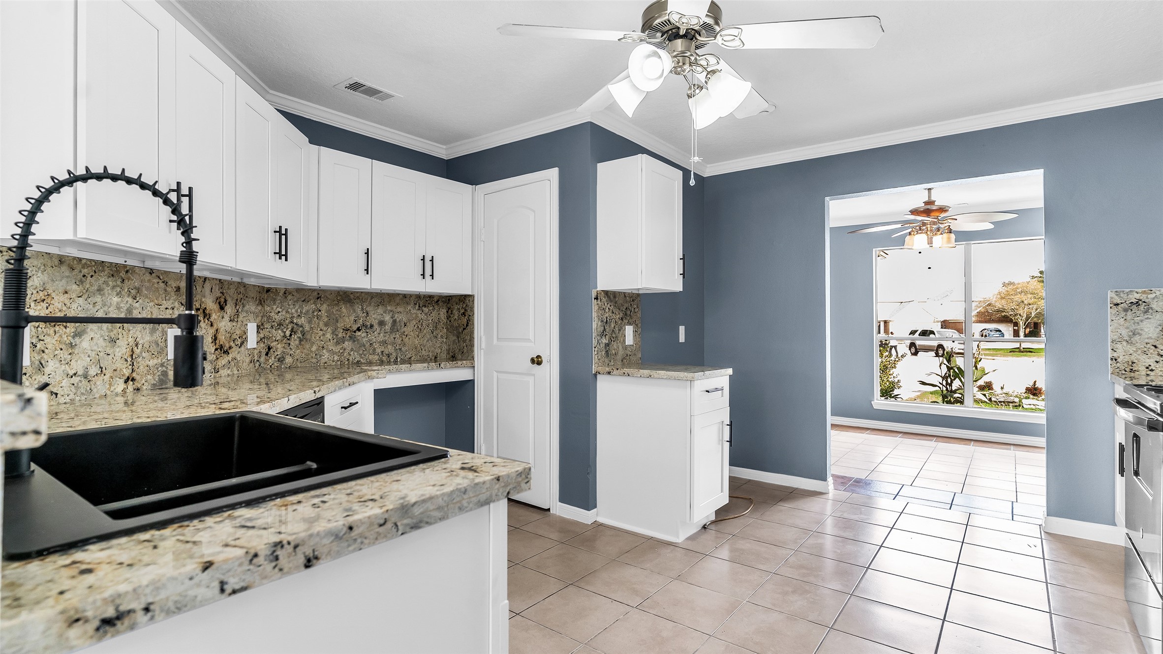 5534 Calm Court Houston, TX 77084 - Photo 8 of 44 a kitchen with a stove a sink and a refrigerator