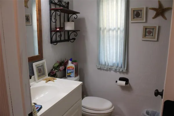 a bathroom with a sink and toilet