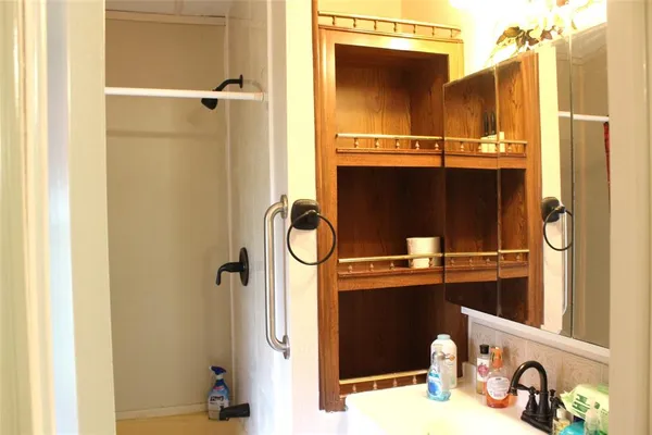 a bathroom with a sink and a mirror