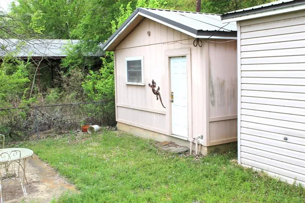 a view of a backyard with potted plants