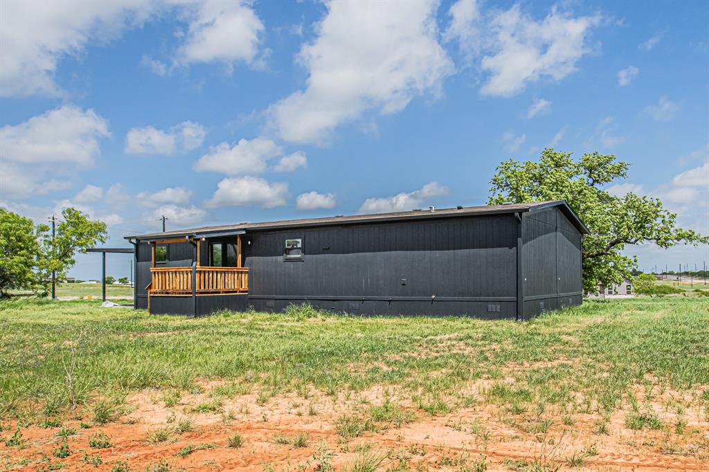 1000 Carnagie Road Poolville, TX 76487 - Photo 31 of 36 a view of a house with a yard