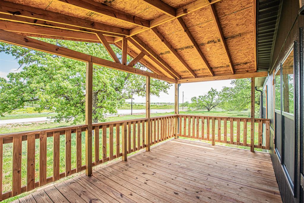 1000 Carnagie Road Poolville, TX 76487 - Photo 6 of 36 a view of outdoor space with wooden floor