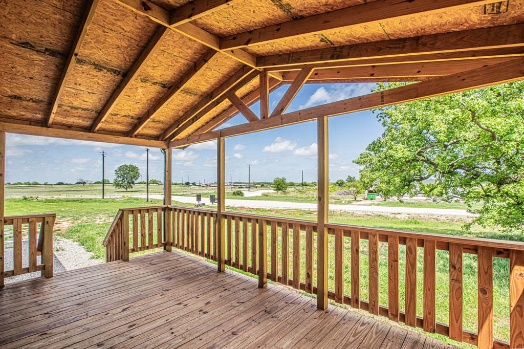 1000 Carnagie Road Poolville, TX 76487 - Photo 7 of 36 a view of a balcony with wooden floor