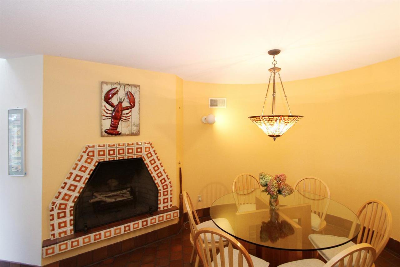 5 First Discovery Road Truro, MA 02666 - Photo 8 of 34 a living room with furniture and a fireplace