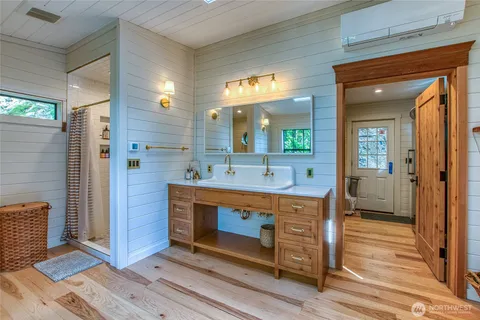 a bathroom with a sink and a mirror
