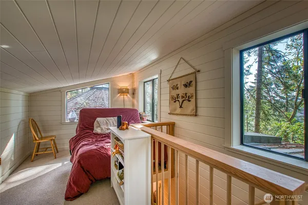 a bed room with furniture and a window