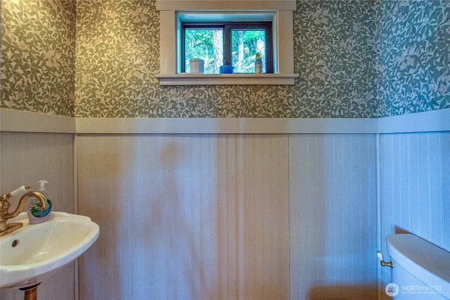 a bathroom with a sink and a window
