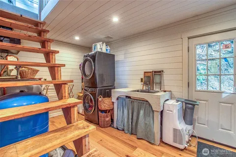 a bedroom with furniture and a window