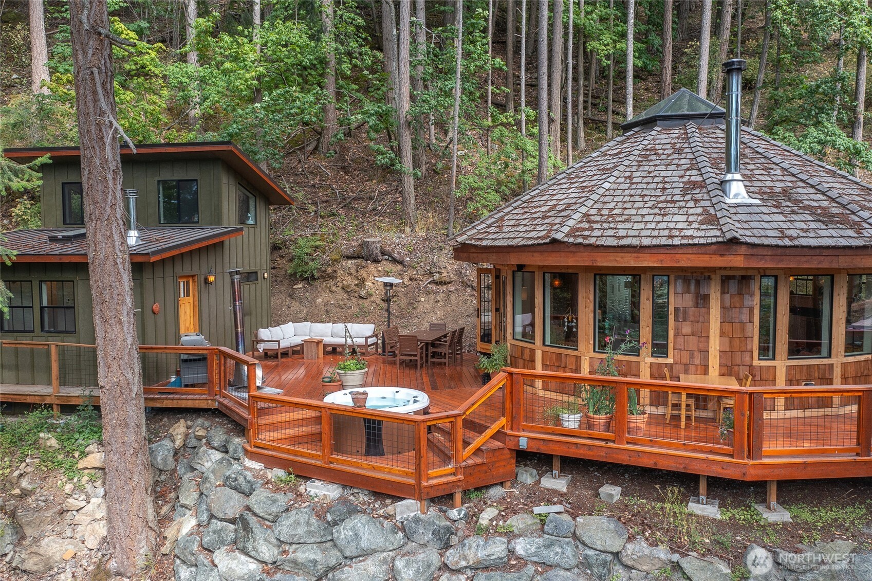 300 Pleasure Horse Road Orcas Island, WA 98245 - Photo 2 of 31 a view of a house with a backyard and sitting area