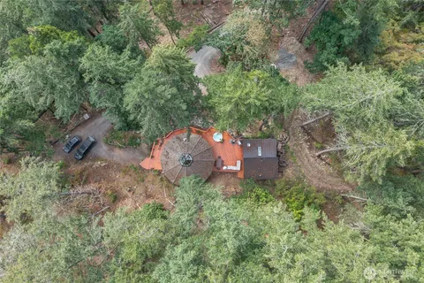 an aerial view of a house with a yard
