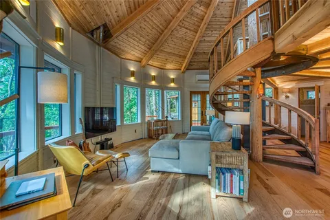 a living room with fireplace furniture and a flat screen tv