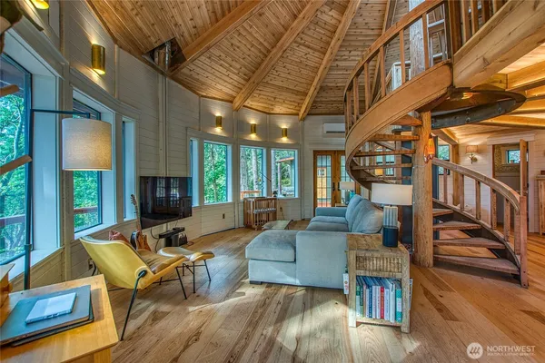 a living room with fireplace furniture and a flat screen tv
