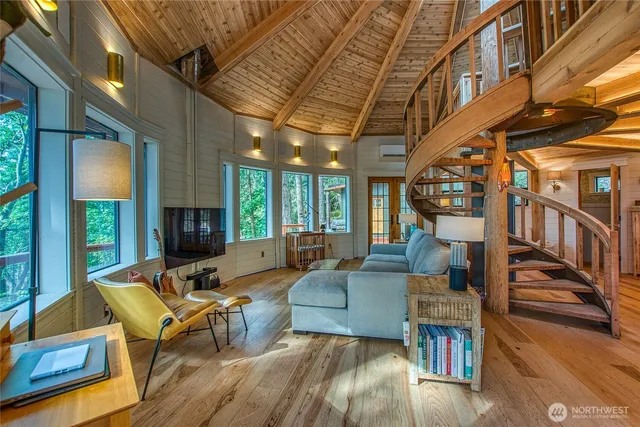 a living room with fireplace furniture and a flat screen tv