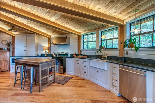 a kitchen with wooden cabinets and sink