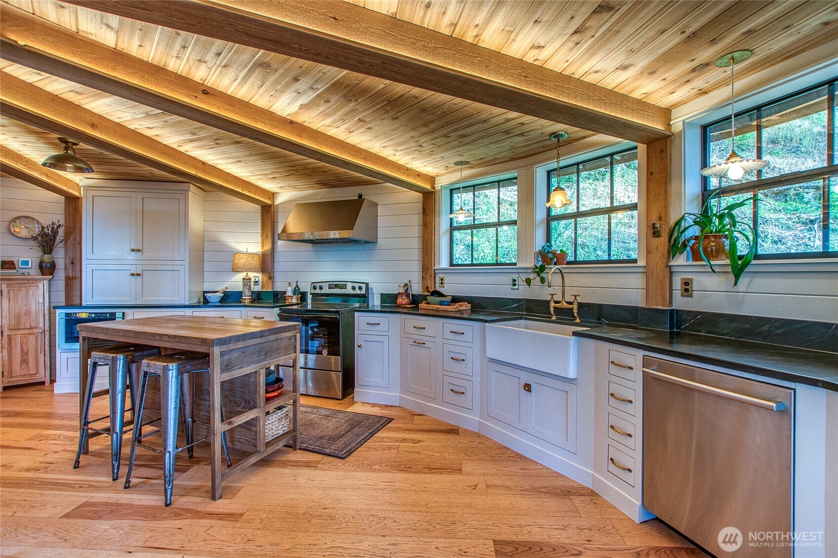 300 Pleasure Horse Road Orcas Island, WA 98245 - Photo 10 of 31 a kitchen with wooden cabinets and sink