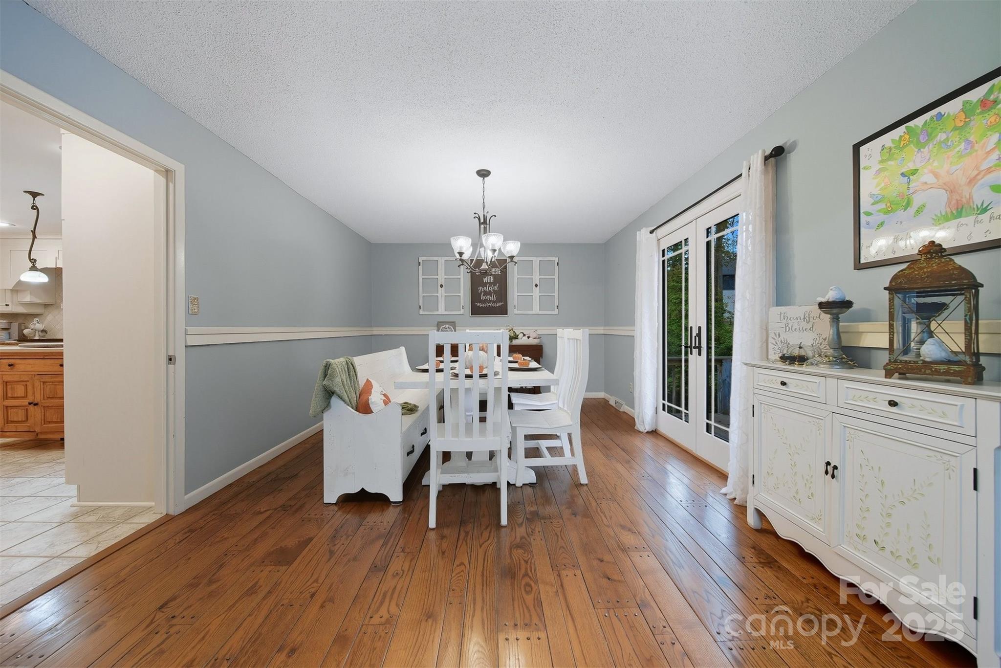507 6th Avenue Northeast Conover, NC 28613 - Photo 12 of 48 a dining room with furniture a chandelier and wooden floor