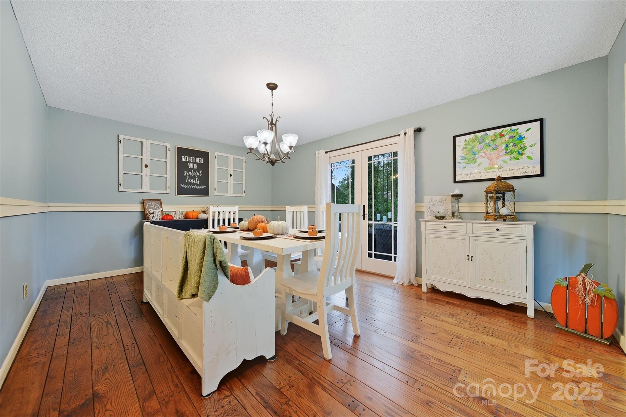 507 6th Avenue Northeast Conover, NC 28613 - Photo 13 of 48 a living room with furniture and a chandelier