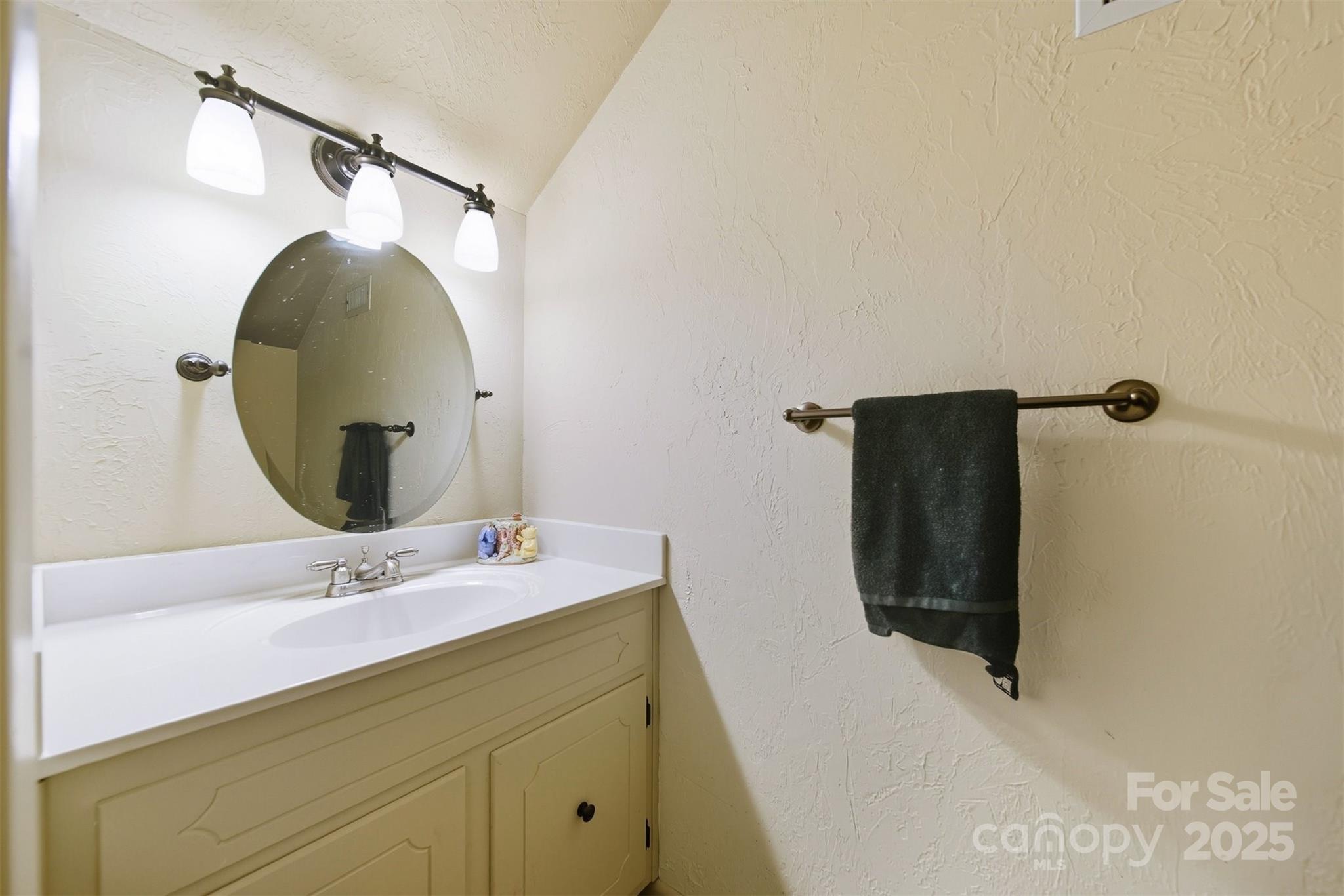507 6th Avenue Northeast Conover, NC 28613 - Photo 17 of 48 a bathroom with a sink and mirror