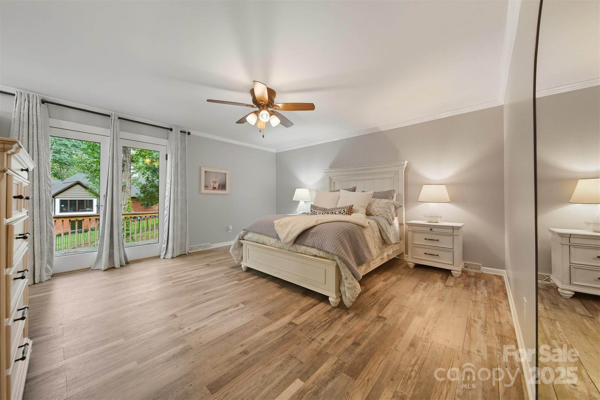 507 6th Avenue Northeast Conover, NC 28613 - Photo 18 of 48 a bedroom with a bed and a chandelier