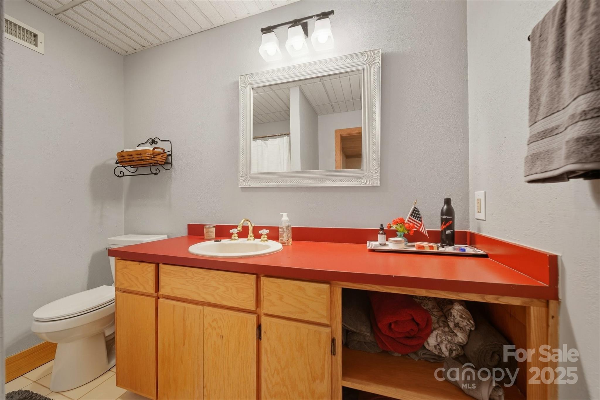 507 6th Avenue Northeast Conover, NC 28613 - Photo 27 of 48 a bathroom with a sink toilet and mirror